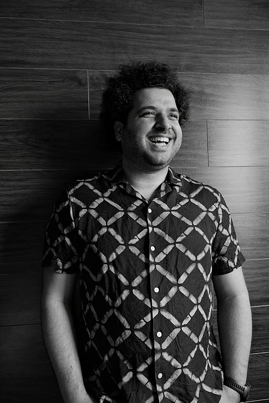 Andreas Poupazis smiling, black and white portrait
