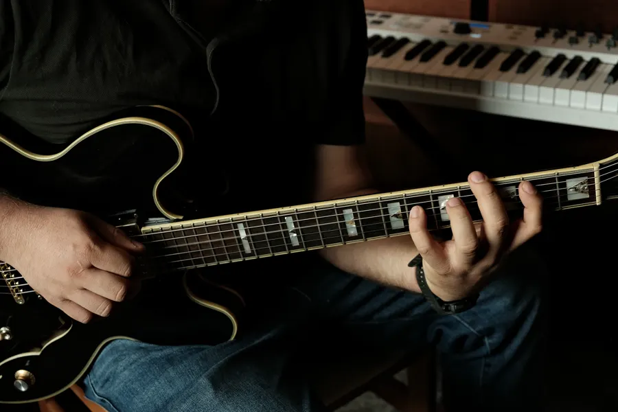 Playing a hollow-body electric guitar